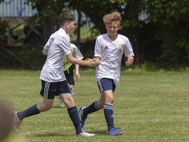 Sterling United soccer’s Landon Camacho (left) and Hudson Lappin celebrates Lappin’s goal Sunday, May 19, 2024 at Scheid Park in Sterling.