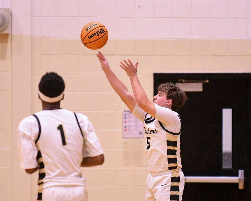 Glenbard North's Kristian D'Alexander, right, makes a three-point basket during the game on Tuesday Jan. 6, 2025, while taking on Geneva held at Glenbard North High School.