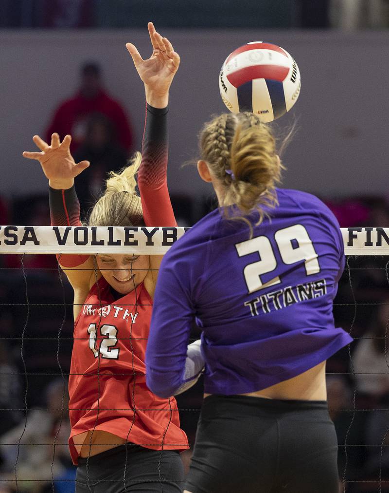 Timothy Christian's Abby VanderWal goes up for a block against El Paso-Gridley's Aubrey Phillips Saturday, Nov. 16, 2024, in the Class 2A third place state volleyball match at CEFCU Arena in Normal.