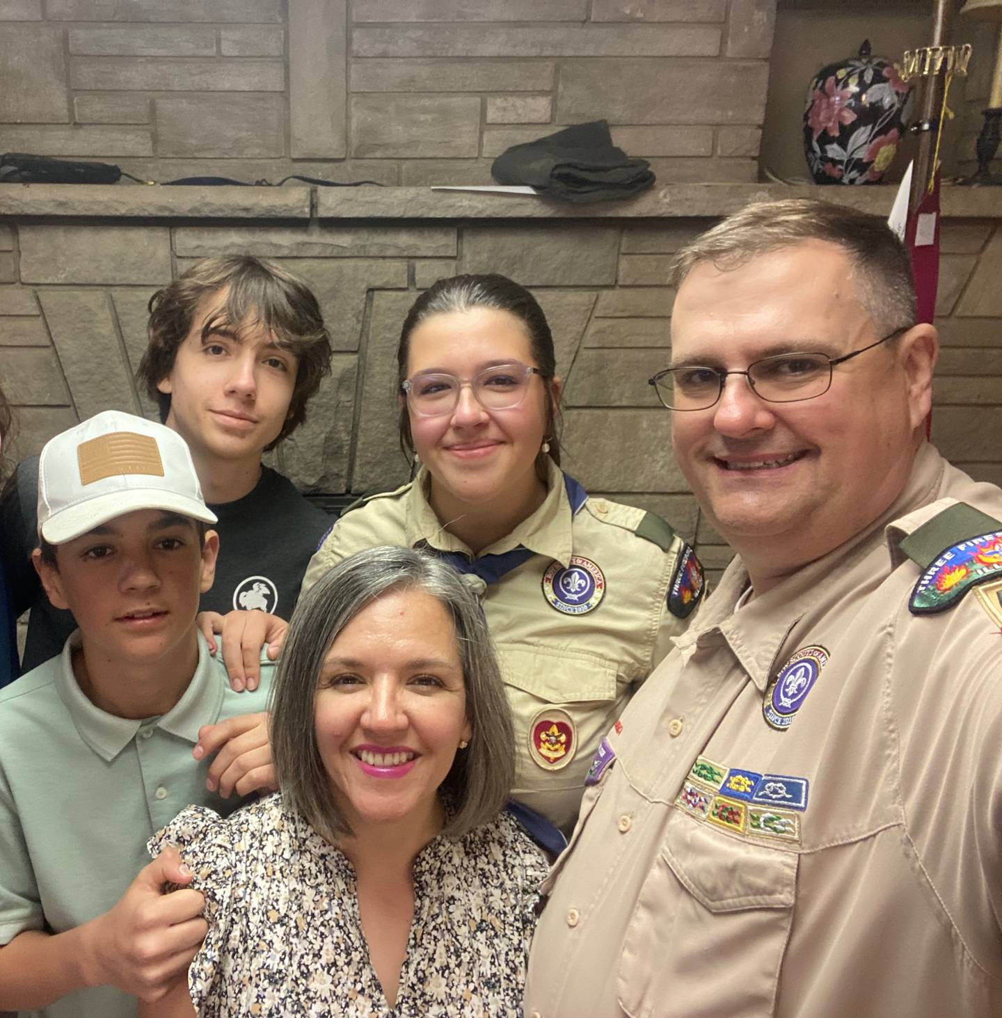 Craig Emmert (far right) served as a logistics specialist during Operation Desert Storm in both Kuwait and Saudi Arabia. Since returning, Emmert has applied his communication skills to helping mentor local Scout Troops. Emmert is pictured with his family as his daughter, Anna, achieves the ranking of Eagle Scout.
