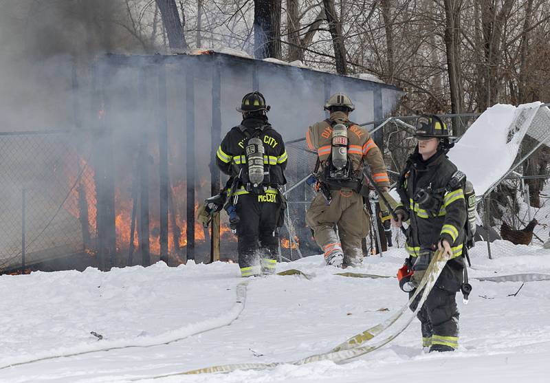 Dixon City and Rural firefighters work to put out a fire that broke out in a shed Monday, Dec. 8, 2025, at 1558 Joliet Way in Dixon.