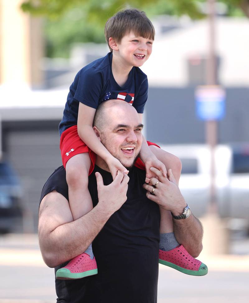 Makie Marts, and his son Taki, 6, from Sycamore, wait Monday, May 29, 2023, for the Sycamore Memorial Day parade to start.