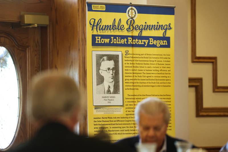 A banner on the history of the Joliet Rotary Club hangs at a luncheon to celebrate the 110th anniversary of the Rotary Club at Jacob Henry Mansion on Tuesday, Aug. 1 in Joliet.