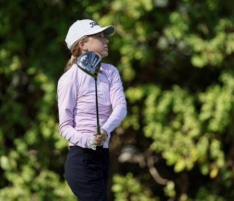 Ariana Savenok of Wheaton North, watches her drive during the IHSA Class 2A West Chicago girls golf regional at St. Andrews Tuesday, Oct. 1, 2024 in West Chicago.