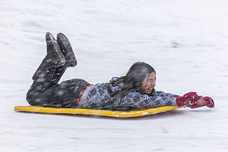 Sophia Rodriguez, 10, picks up speed as she takes advantage of the snow Tuesday, Jan. 9, 2024 at E.C. Smith Park in Dixon.