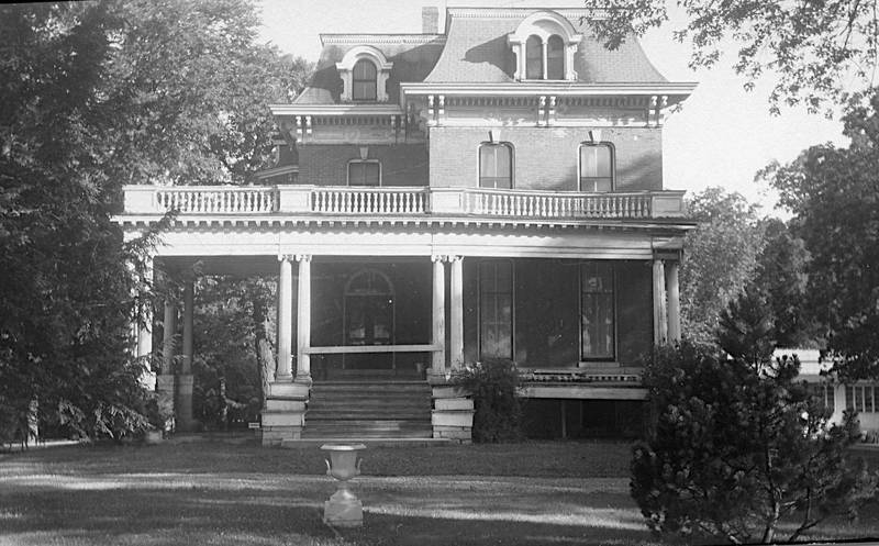 The county tuberculosis sanitarium on Sycamore Road in DeKalb, formerly the Charles W. Marsh house, receives repair work on the front porch in July 1958.