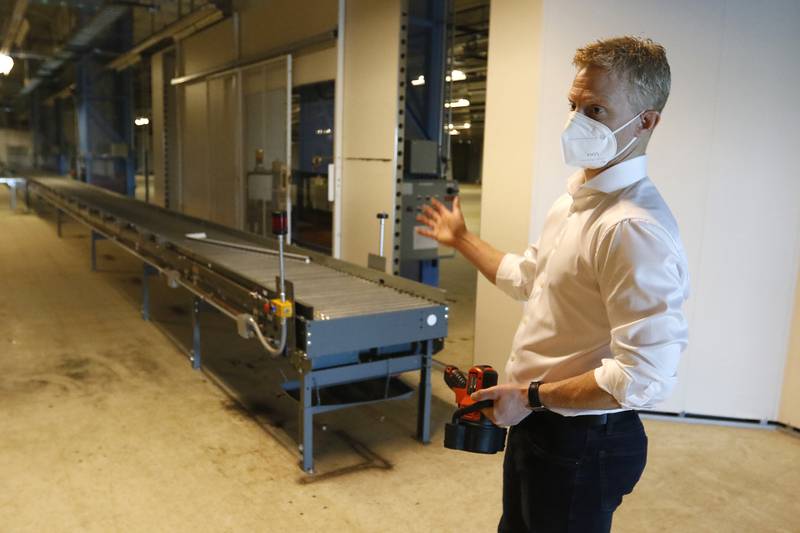 Sean Stofer, COO of Green Data Center Real Estate, Inc.,  shows a manufacturing area inside the property at the former Motorola headquarters on Thursday, June 10, 2021 in Harvard.