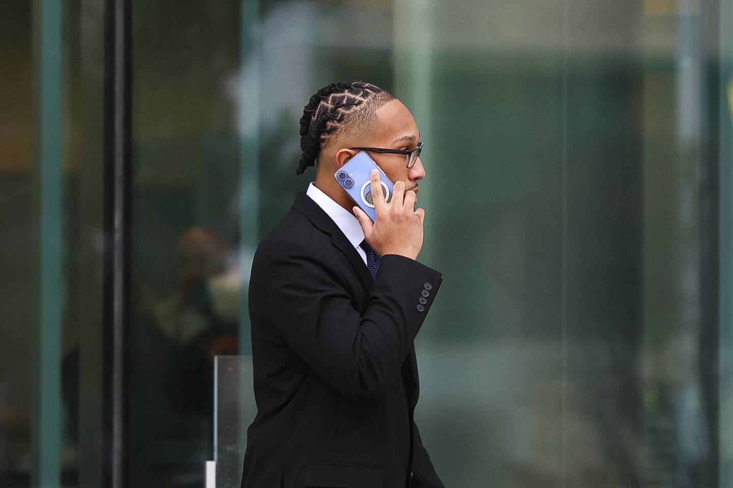 Joliet Police Officer Christopher McClinton leaves the Will County Courthouse after an arraignment on Wednesday, Dec. 31, 2025 in Joliet. McClinton is was charged with a felony for allegedly using a counterfeit $100 bill to buy lottery tickets July 13, 2025.