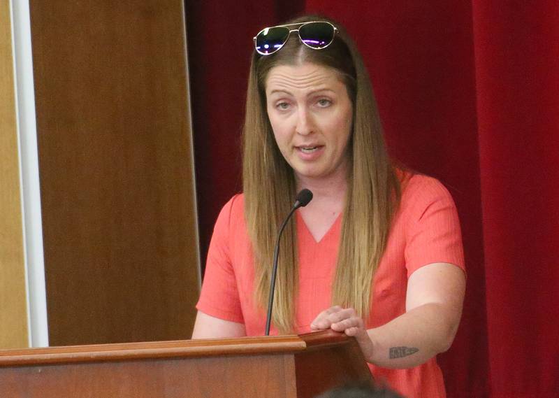 Justine Larabee speaks to the Illinois Health Facilities and Services Review Board during a public hearing regarding OSF St. Elizabeth Hospital's plans to reduce services on Tuesday, June 10, at Central Intermediate School in Ottawa.