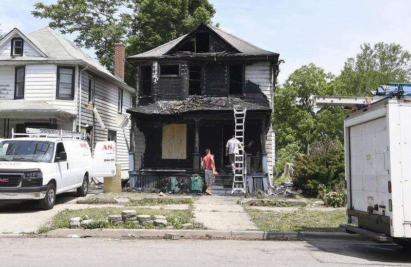 ASAP Board Up Service and XR Expert Restoration working on the house at 16 S. Center from an overnight fire the left three dead in Joliet, Ill. on Saturday, June 03, 2017. | Larry W. Kane for Shaw Media.