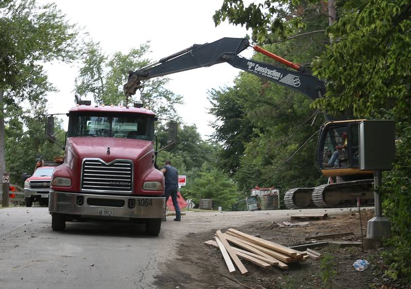 A crew with D Construction loads materials onto a flat bed truck while working on Tuesday, Sept. 5, 2023 at Matthiessen State Park. This project will reconstruct a retaining wall along the park’s entrance road. Other improvements include new pavement, gutters and guardrails. Following the closures, traffic will be reduced to one lane and will be controlled by signals during the project, which is expected to be completed by Nov. 30.
