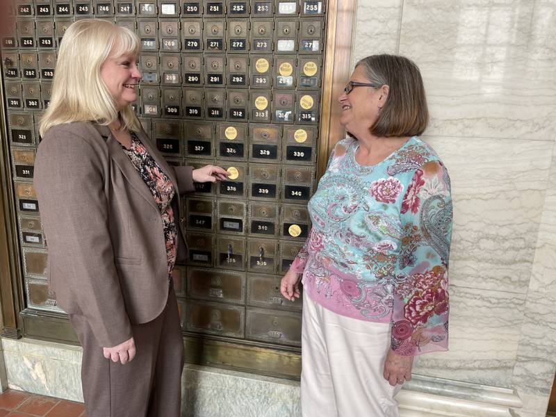 Donor Susan Monroe (left), of McNabb, selects her entry in the Mailbox Challenge fundraiser sponsored by Starved Rock Country Community Foundation. The foundation is selling the former mailboxes for $100 each as part of a fundraiser. Monroe is pictured with SRCCF Director of Operations Janice Corrigan.