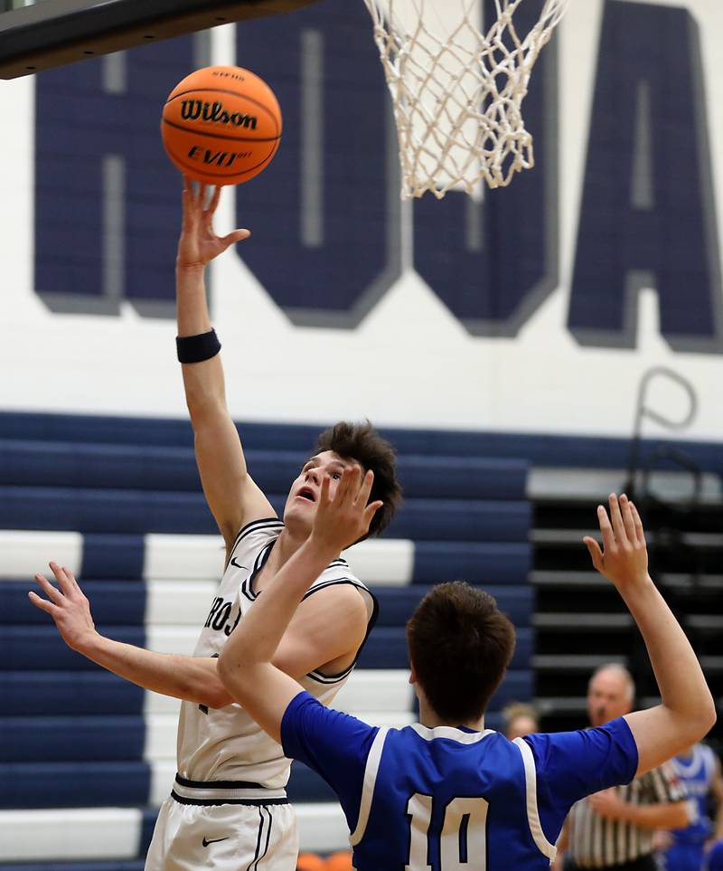 Cary-Grove's Dylan Dumele shoots the ball over Burlington Central's Colton O'Neil during a Fox Valley Conference  boys basketball game on Wednesday Jan. 7,  2026, at Cary-Grove High School, in Cary.