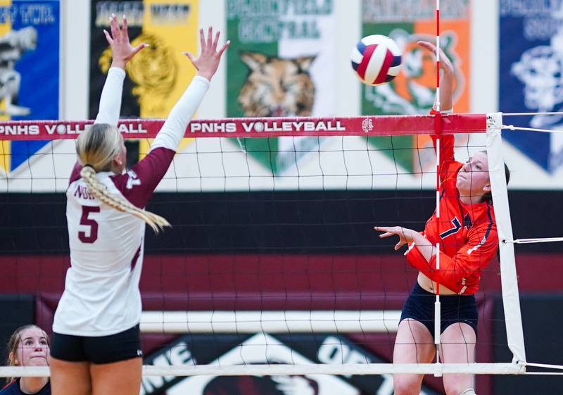 Oswego’s Kelsey Foster (7) goes up for a kill against Plainfield North's Elizabeth Fitzgerald (5) during the class 4A Plainfield North regional volleyball final at Plainfield North High School on Thursday, Oct. 26, 2023.