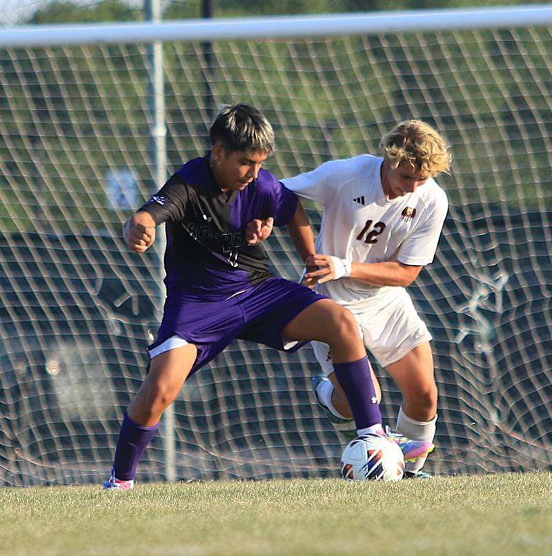 Rochelle's Saul Avila (in purple) fights for possession of the ball during a game with Morris on Sept. 17, 2025. Rochelle won the game 2-1.