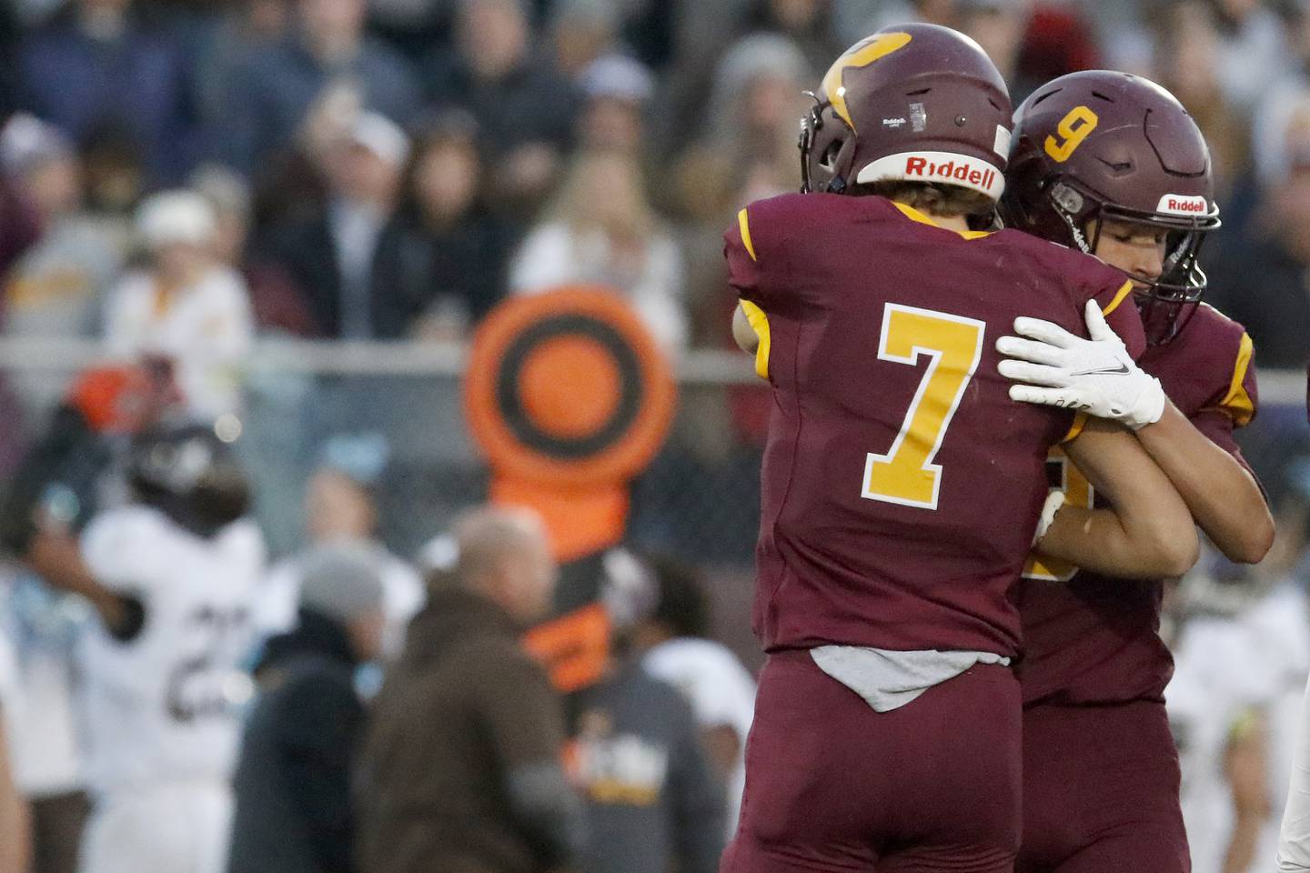 Richmond-Burton's Daniel Kalinowski, facing, hugs teammate and quarterback Joseph Miller after their IHSA Class 4A semifinal football game on Saturday, Nov. 20, 2021 at Richmond-Burton High School in Richmond. Joliet Catholic won 35-18, delivering Richmond-Burton their first loss in three years.