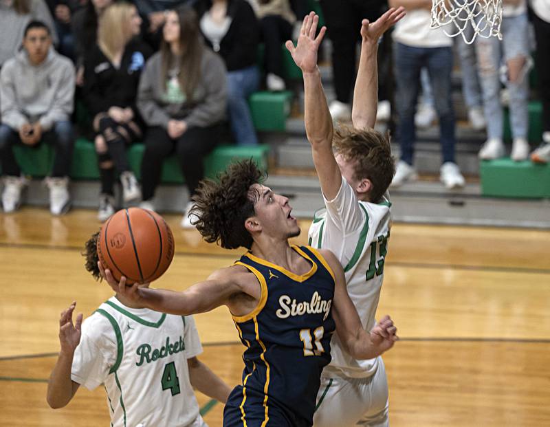 Sterling’s Nico Battaglia works to put up a shot against Rock Falls Tuesday, Nov. 28, 2023 in Rock Falls.