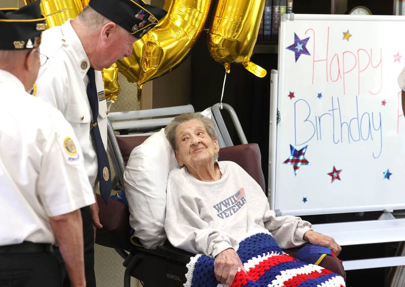 World War II veteran Myrtle Annetta Lusiak greets well-wishers Thursday, May 2, 2024, during her birthday celebration at Aperion Care in DeKalb. Lusiak, who turned 107-years-old, was honored by DeKalb officials, veterans and other local groups Thursday for her service in the Women’s Army Corps from Aug. 5, 1943 until her honorable discharge on Nov. 27, 1945.