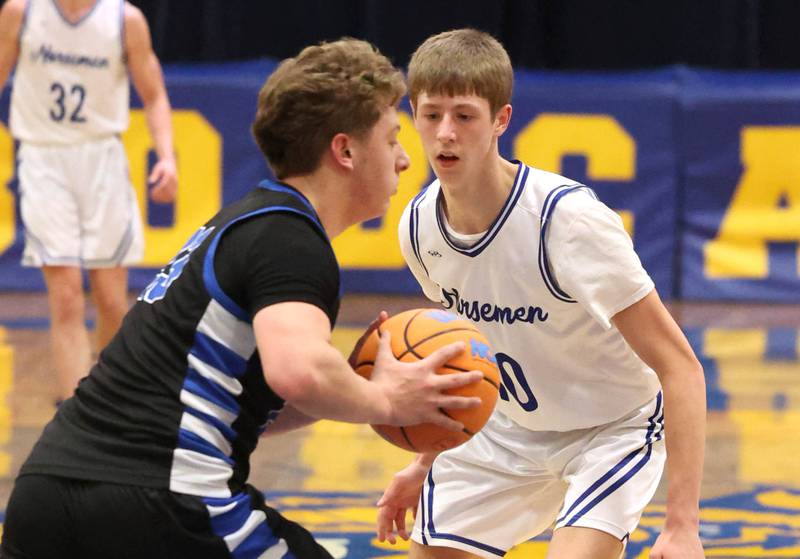 Newark's Dylan Kulbartz plays defense against Hinckley-Big Rock's Luke Badal Friday, Feb. 6, 2026, during their Little 10 Conference third place game at Somonauk High School.