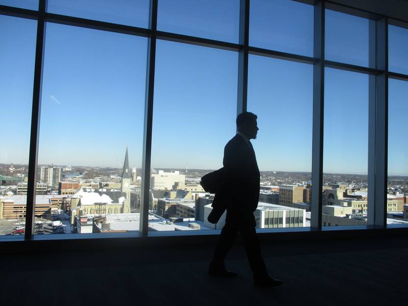 Joliet Councilman Juan Moreno paces on the eighth floor of the Will County Courthouse before the start of a hearing on Thursday on his legitimacy to hold office.
