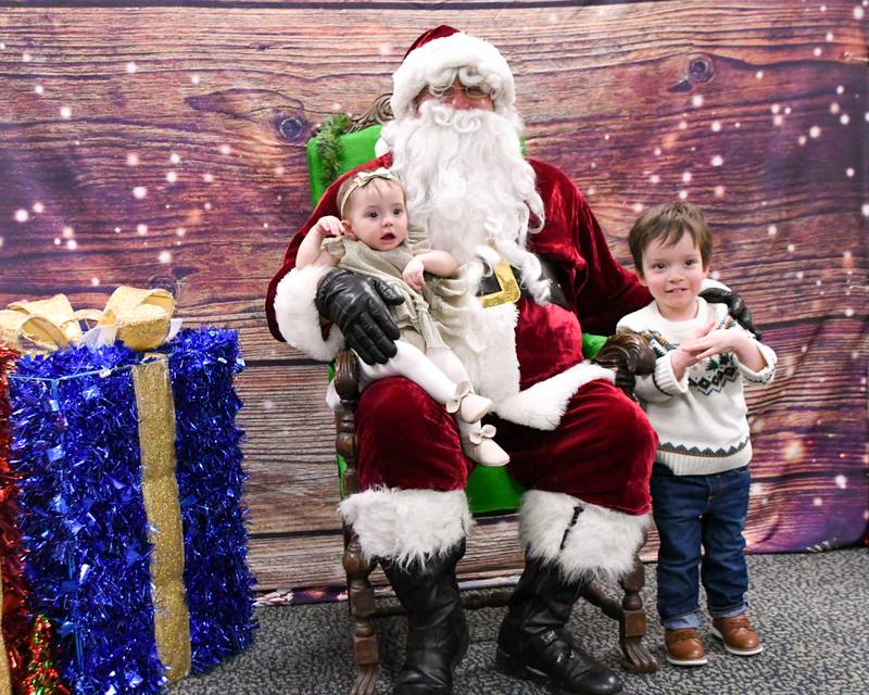William White, 3, and his sister Alice White, 7 months, pose for a photo with Santa during the breakfast with Santa event on Sunday Dec. 15, 2024, held at La Grange Park District Recreation Center.