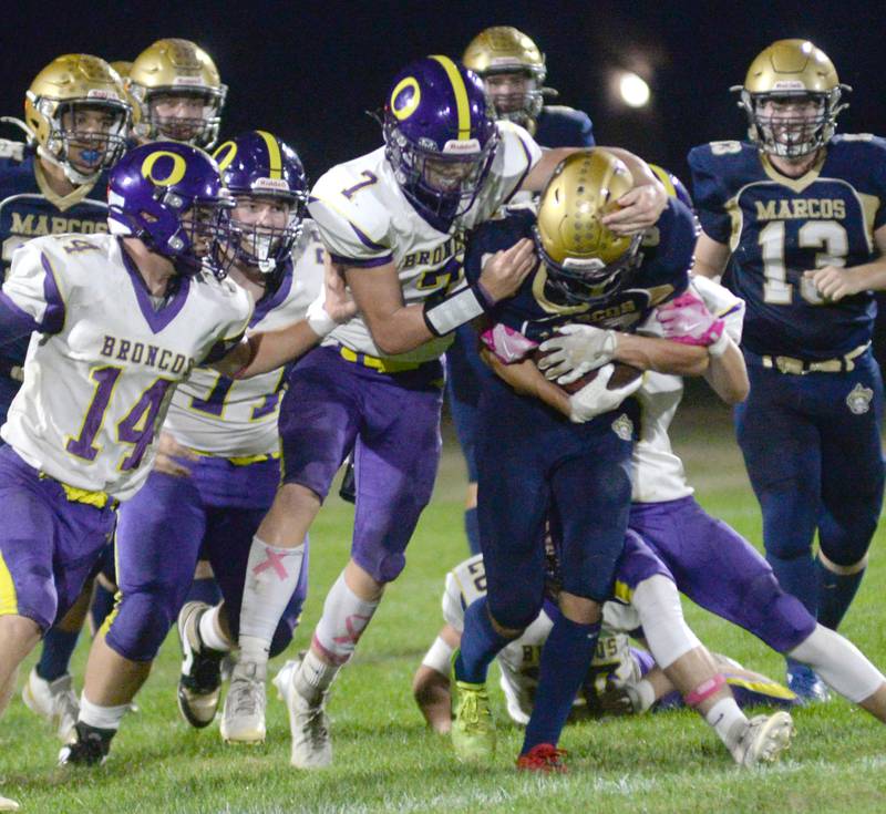 Polo's Mercer Mumford (83) fights for yards as he runs for a big gain against Orangeville during 8-man action at Polo High School on Friday, Oct. 3, 2025