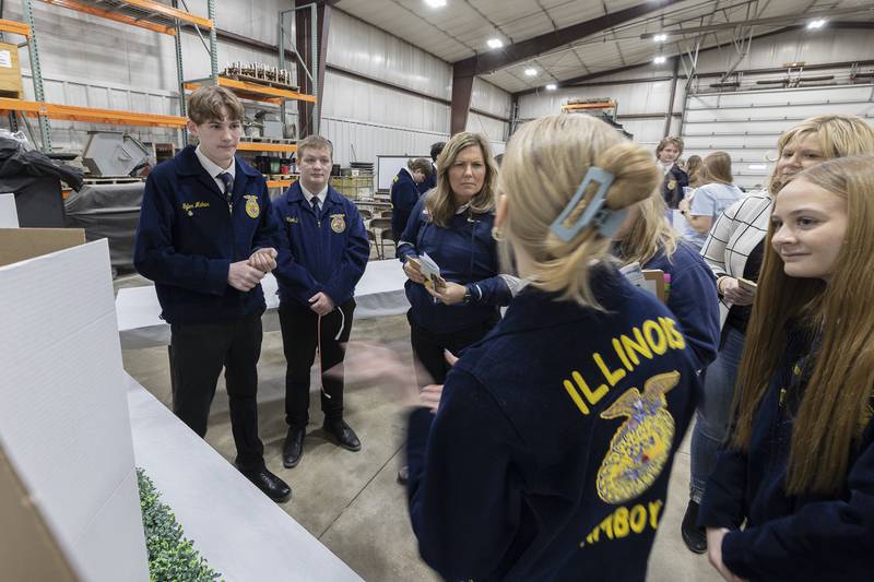 Amboy FFA members Tyler Mahar (left) Bryan Boyer, Ana Carlson and Grace Althaus greet visitors Friday, Feb. 27, 2026, at Cultivating Connections in Agriculture in Nachusa. The event brings FFA programs from across the area to meet, learn and exchange ideas.