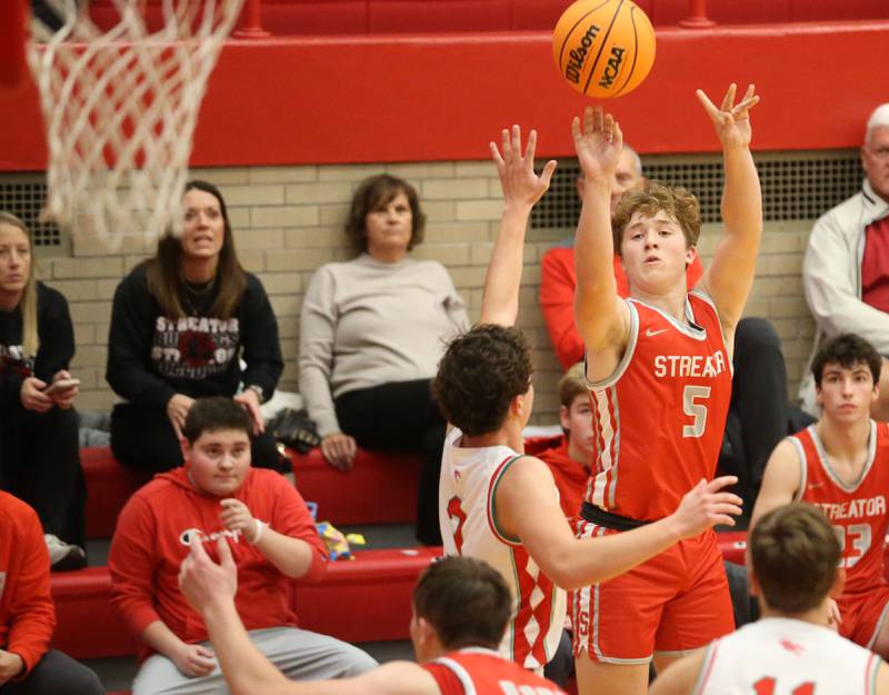 Streator's Isaiah Weibel sinks a three point basket over L-P's Mikey Hartman during the Dean Riley Shootin' The Rock Thanksgiving Tournament on Monday, Nov. 25, 2024 in Kingman Gym at Ottawa High School.