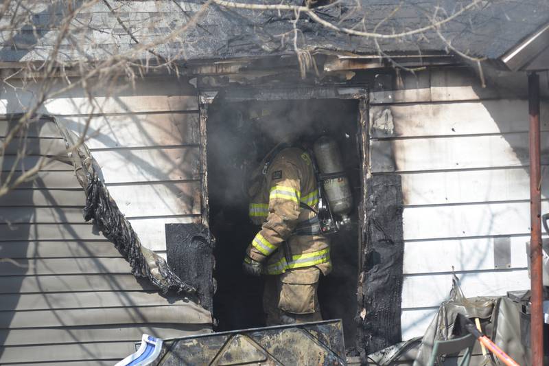 A firefighter works inside a home at 2010 S. Second St. in Daysville on Wednesday, March 12, 2025.