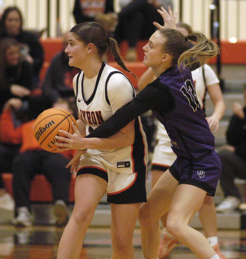 Byron's Aubrie Fuller  looks to pass the ball while defended by Dixon's Grace Ackert.  The Byron Tigers won over the Dixon Duchesses 46-43 in overtime. The girls basketball game took place at Byron on Saturday, January 24th, 2026