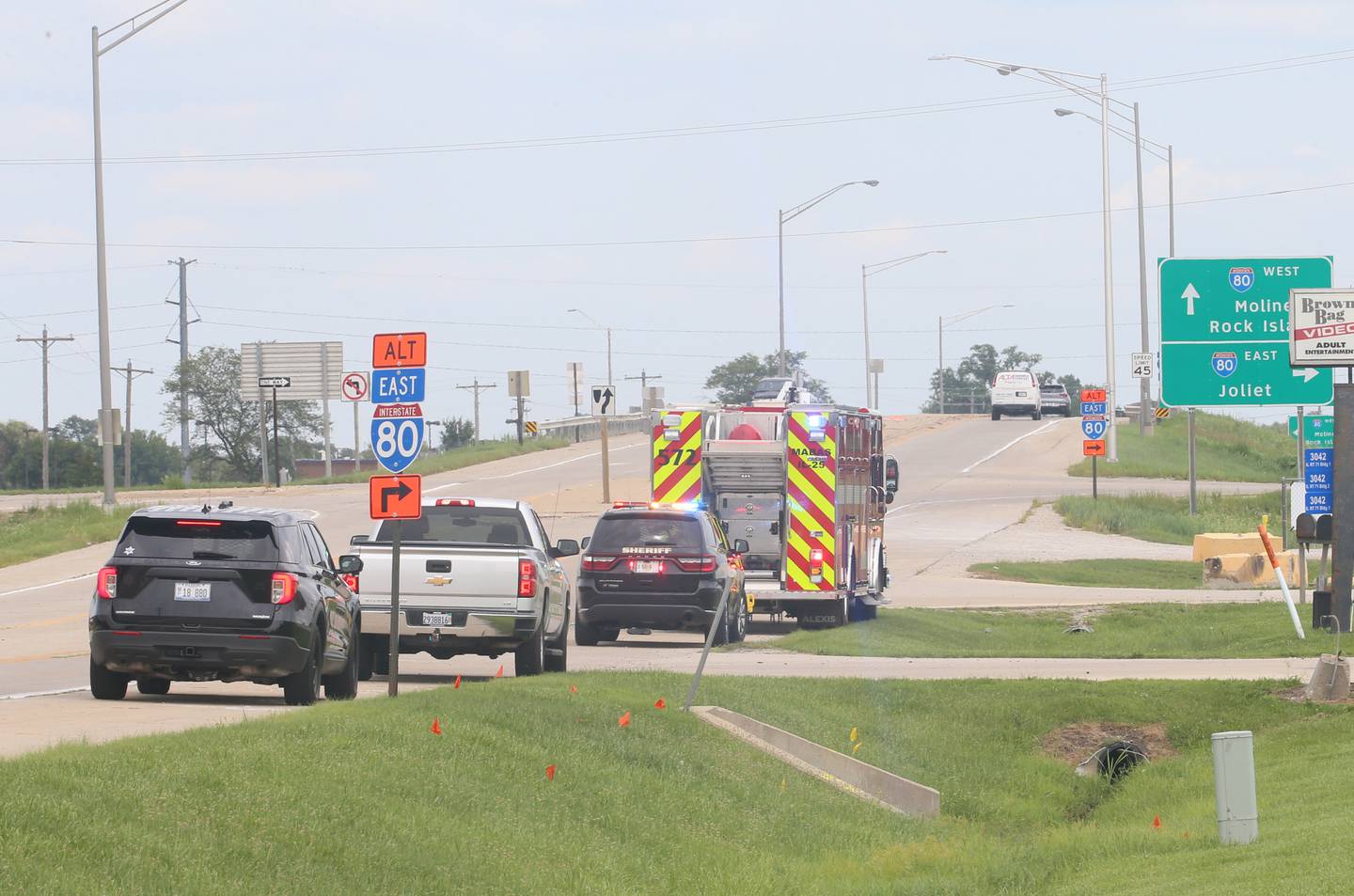 Emergency vehicles pull to the shoulder as a Life Flight helicopter loads a patient involved in a multiple vehicle crash a mile east of the Route 71 and Interstate 80 interchange on Wednesday, Aug. 2, 2023, near Ottawa.