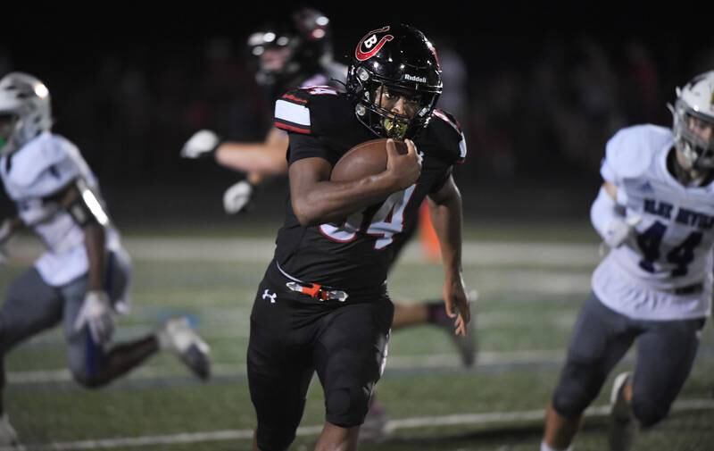 Barrington’s Calvin Jackson runs for a touchdown against Warren at Barrington High School Friday, August 25, 2023.