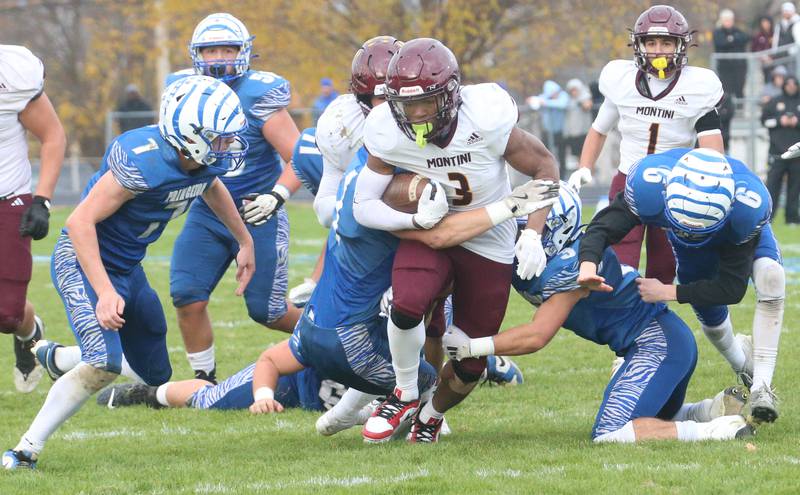 Montini Catholic's JoJo James plows through the Princeton defense during the Class 3A quarterfinal game on Saturday, Nov. 16, 2024 at Bryant Field in Princeton.