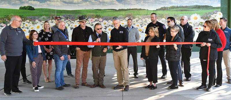Officials from Romeoville, Lockport, the Forest Preserve District of Will County and CITGO attend the ribbon cutting officially opening the new trail connecting the I&M Canal and Centennial Trails in Romeoville on Oct. 7, 2024.  Grant money donated by CITGO was cooperatively used by the village of Romeoville, the city of Lockport, and the Forest Preserve District to develop the connection.