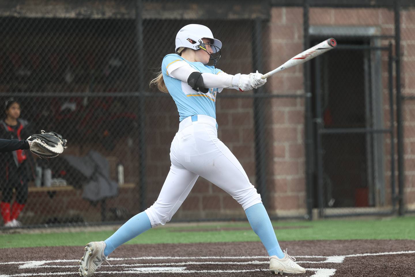 Joliet Catholic’s Madison Patrick connects for a double against Bolingbrook on Monday, April 3, 2023.