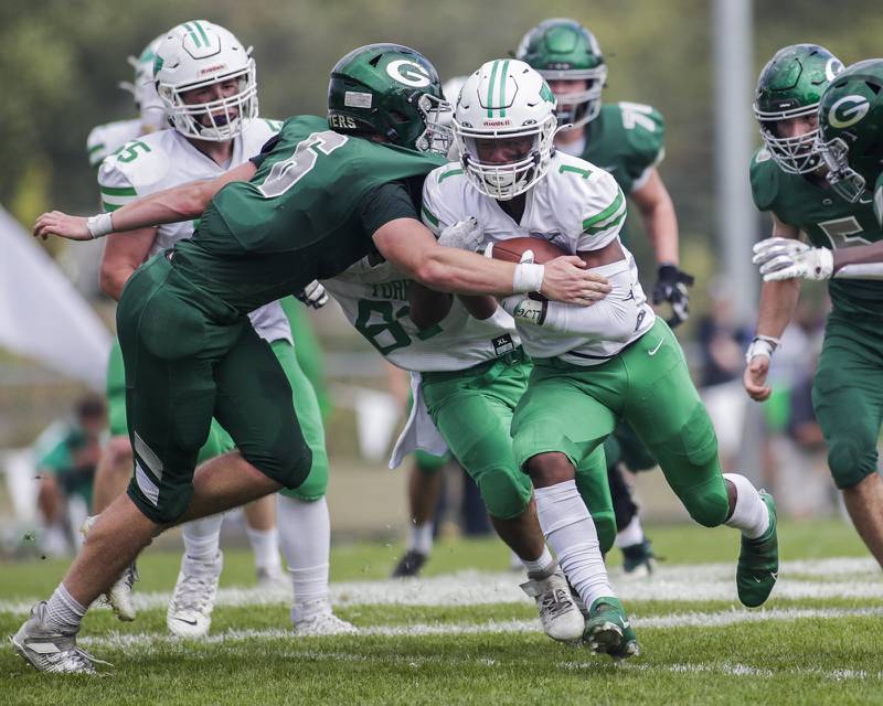 York's Kelly Watson carries the ball against Glenbard West's Jack Oberhofer during a game in Glen Ellyn on Saturday, Oct. 2, 2021.
