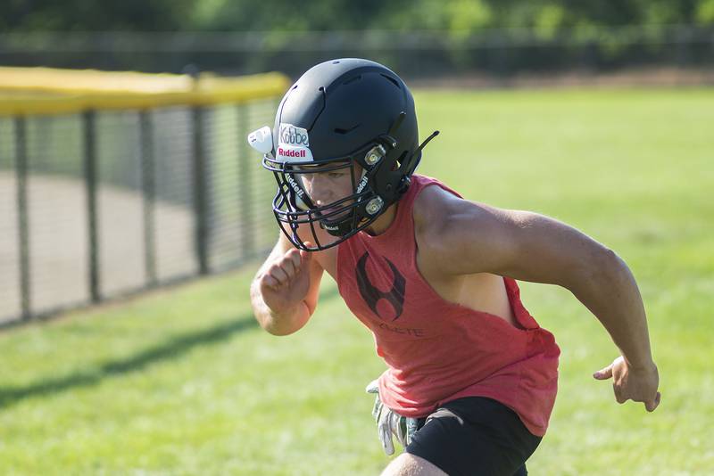 Rock Falls High School football player Aidan Kobbeman finishes his run Tuesday, July 19, 2022 during camp.