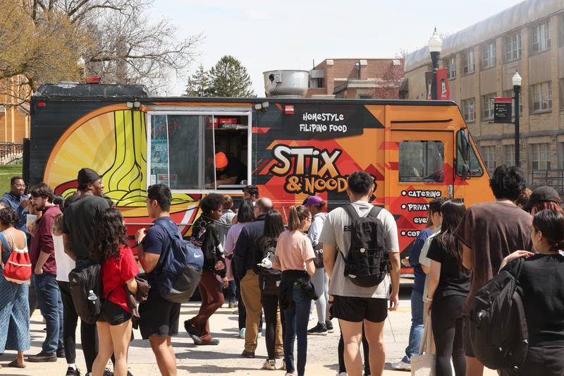 The lines grow at the food trucks Wednesday, April 10, 2024, during Food Truck Wednesday at Northern Illinois University. Food trucks, entertainment and games will all be available on campus from 11 a.m. to 2 p.m. on Food Truck Wednesdays.