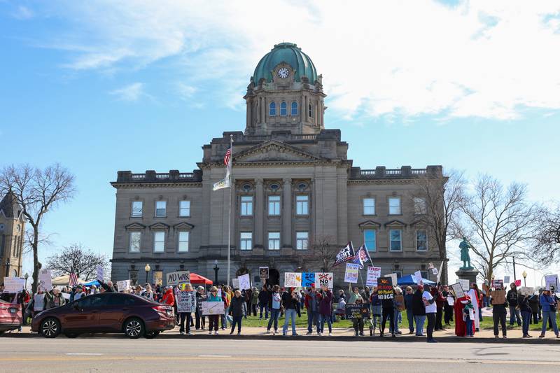Protesters participate in the No Kings rally at the Kankakee County Courthouse on March 28, 2026.