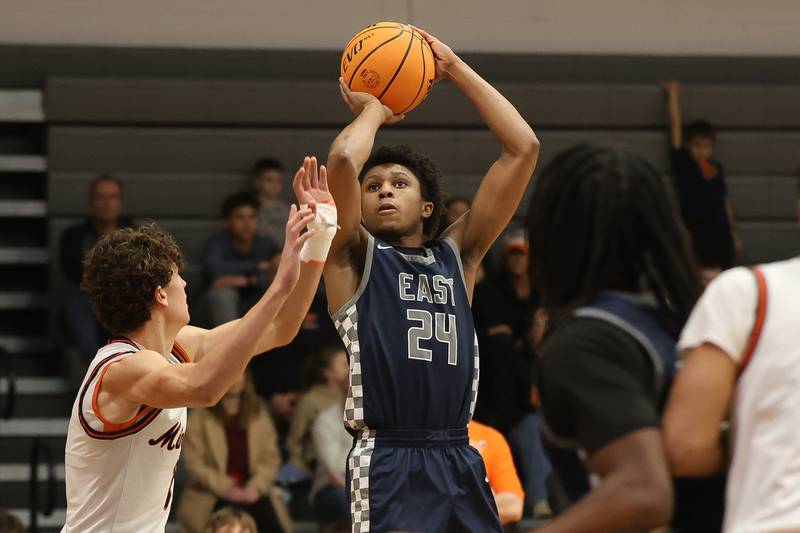 Oswego East’s Dshaun Bolden puts up an outside shot against Minooka on Friday, Jan. 16, 2026 in Minooka.