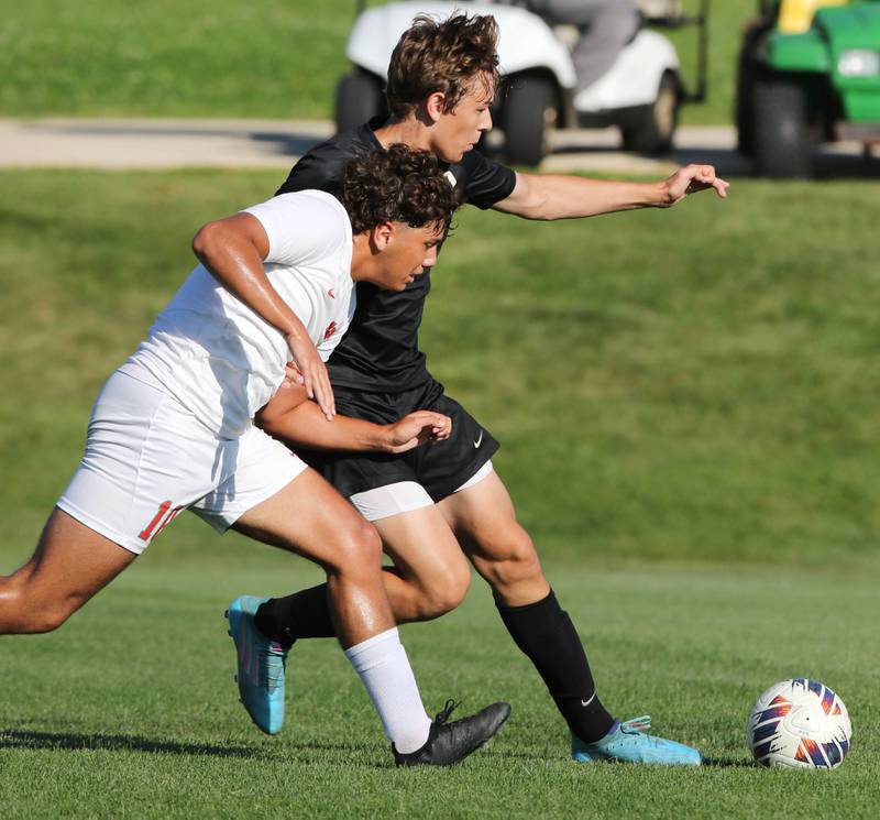 La Salle-Peru's Giovanni Garcia (left) and Sycamore's Carter England go after the ball during their game Wednesday, Sept. 7, 2022, at Sycamore High School.