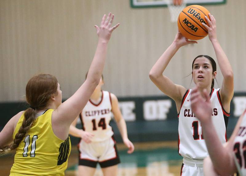 Amboy/Ohio's Tyrah Vaessen looks to shoot a jump shot over Putnam County's Maggie Spratt during the Class 1A Regional semifinal game on Tuesday, Feb. 18, 2025 at St. Bede Academy.