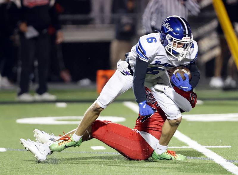 Riverside Brookfield's Xavier Mrozik-DeJesus (6) tries to break the tackle of Glenbard East's Randy Garcia (17) during the varsity football game between Riverside Brookfield and Glenbard East on Friday, Oct. 24, 2025 in Lombard, IL.