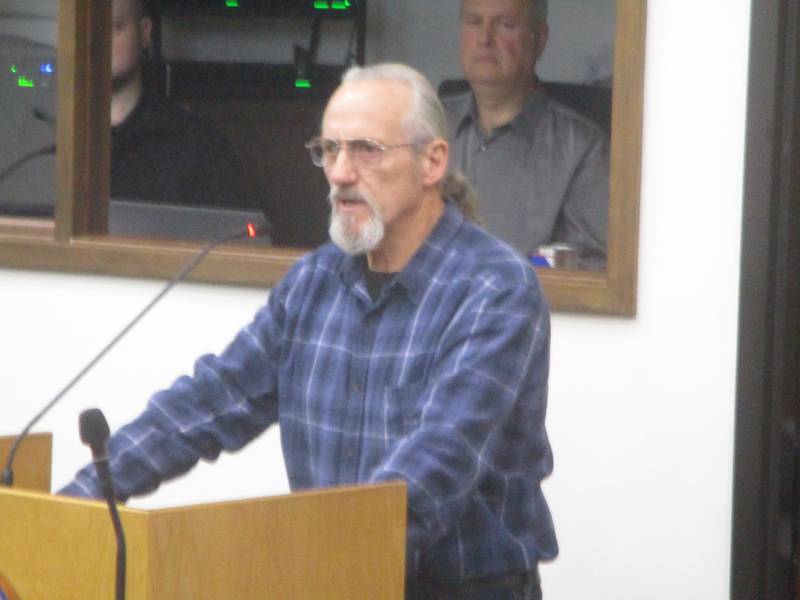 Peter Christodolas speaks against the 3,600-acre solar panel project proposed near his home in southern Will County,