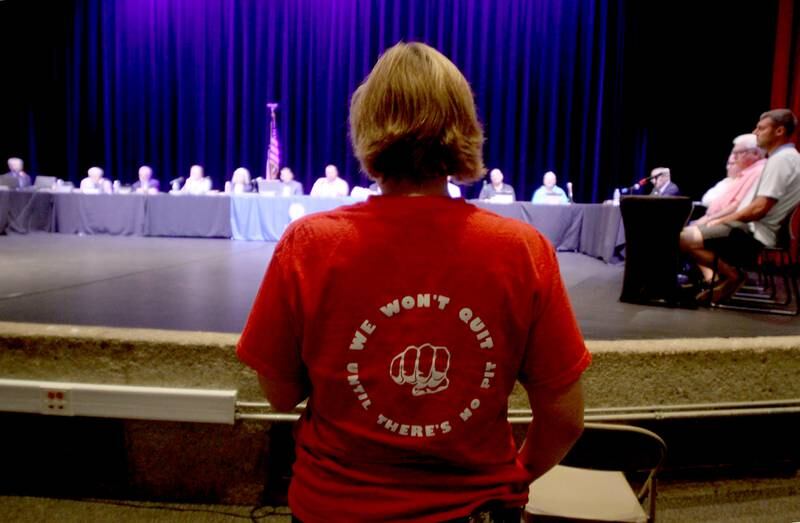 Stephanie Tesmer of McHenry speaks during public participation as the McHenry City Council on Monday, Aug. 7, 2023, addressed a Jack Pease proposal to mine 110 acres at Route 120 and Chapel Hill Road. The meeting was held in McHenry High School’s Upper Campus auditorium.