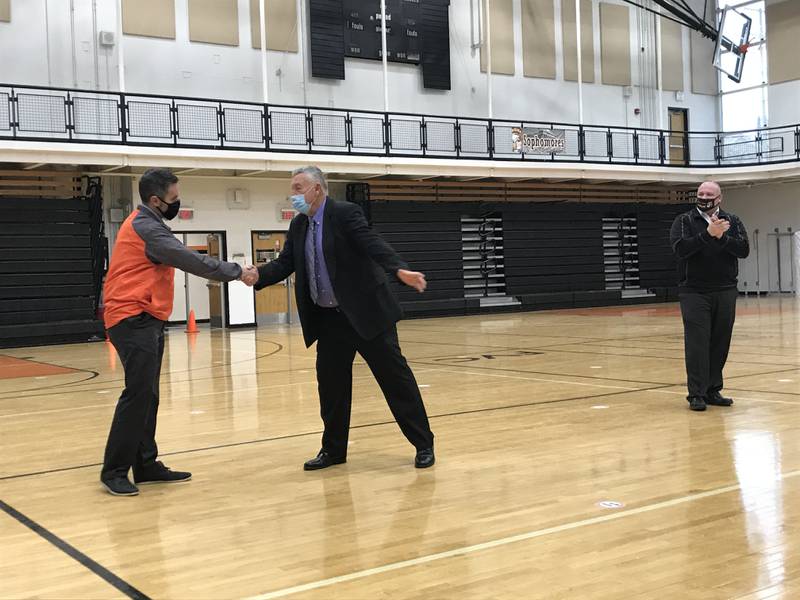McHenry High School East Campus Principal Jeff Prickett, far left, is named Illinois High School Principal of the Year for 2021. He is pictured here, shaking hands with Frank Conroy from Illinois Principals Association.