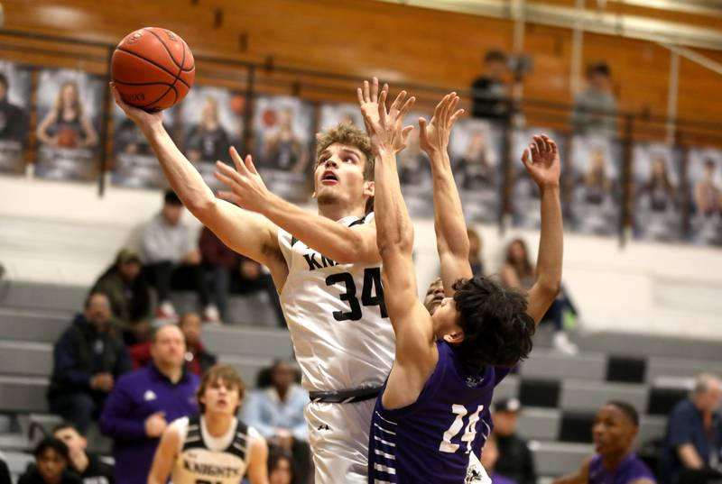 Kaneland’s Parker Violett puts up a shot during a game against Plano in Maple Park on Tuesday, Dec. 20, 2022.