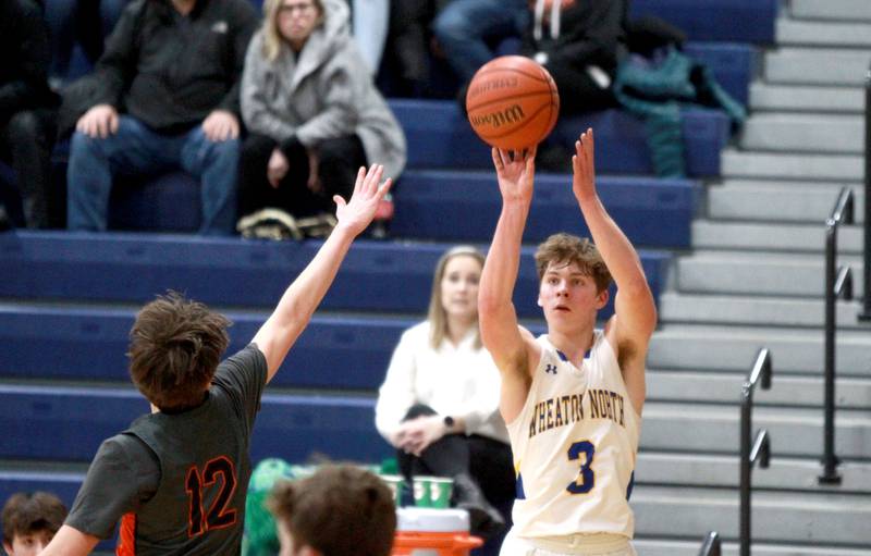 Wheaton North’s Jack Speers shoots three points during a game against St. Charles East at Wheaton North on Thursday, Jan. 25, 2024.