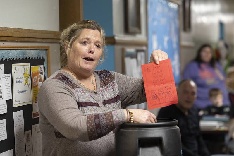 Open Sesame teacher Billie Jo Laidig shows off a Lincoln School holiday program from 1999 Monday, Dec. 23, 2024.