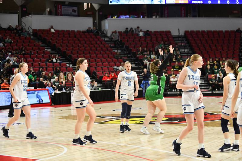 CIssna Park's Addison Lucht, center, leaves the court with her team following the Timberwolves' 55-39 loss to Carrollton in the IHSA Class 1A State semifinal on Thursday, March 6, 2025. Cissna Park advances to the third place game on Friday, March 7.